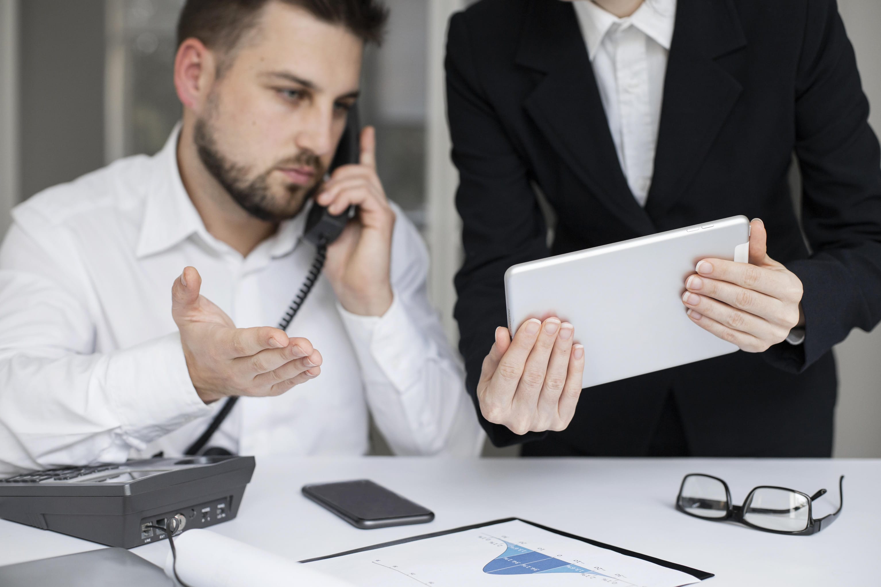 business people meeting around table with charts