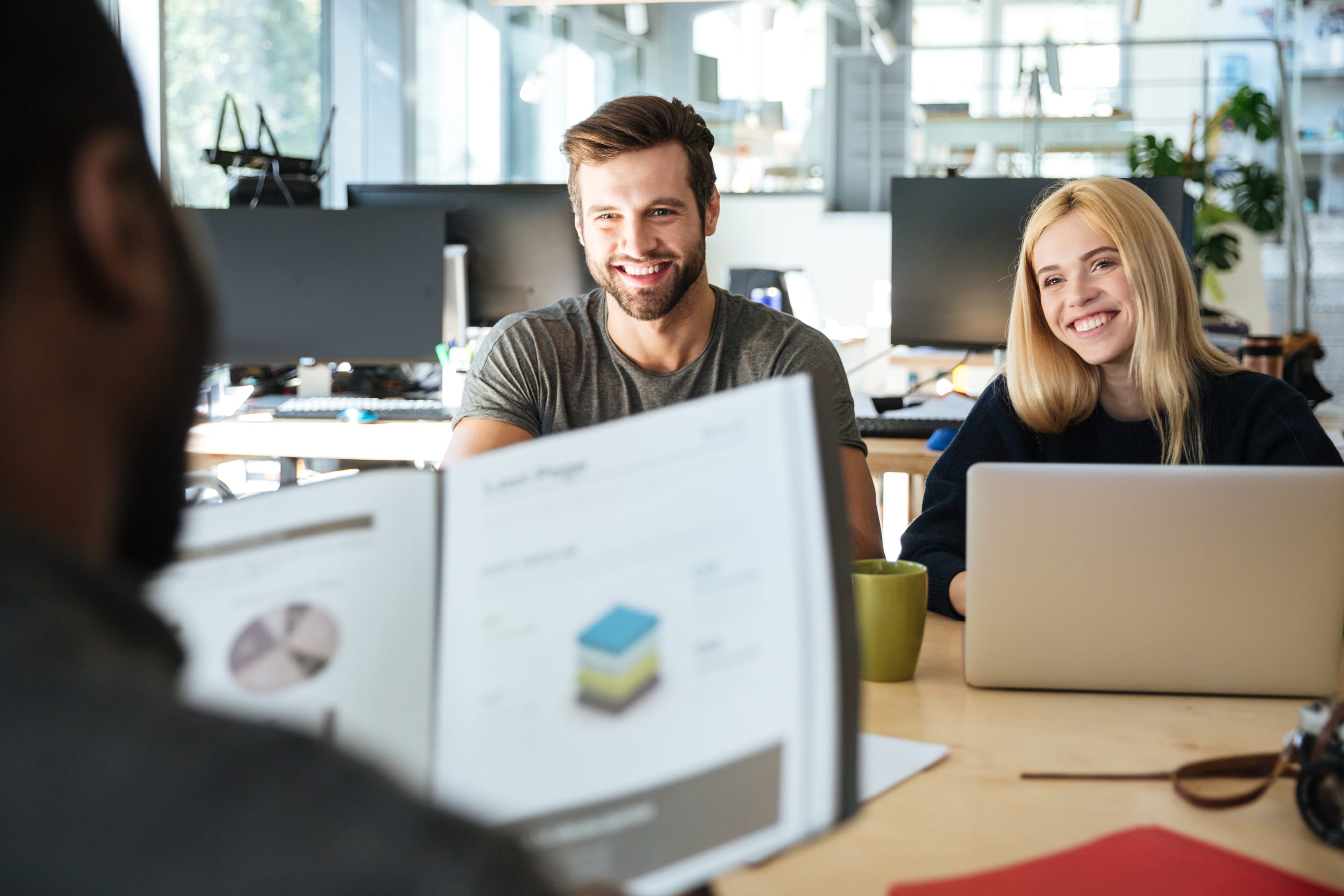 business people meeting around table with charts