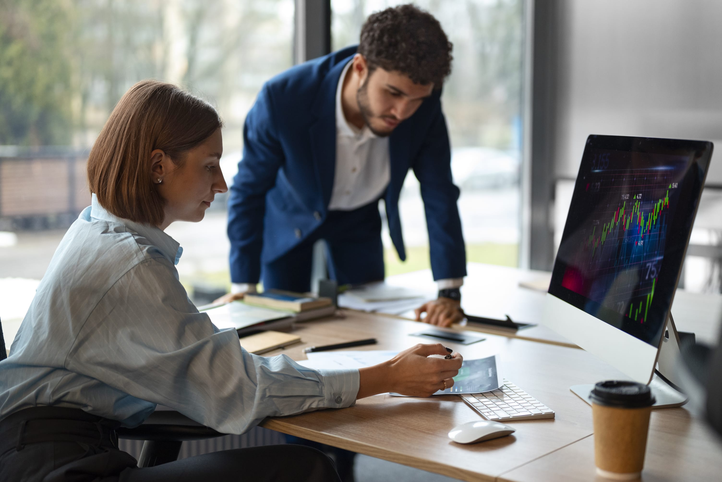 business people meeting around table with charts