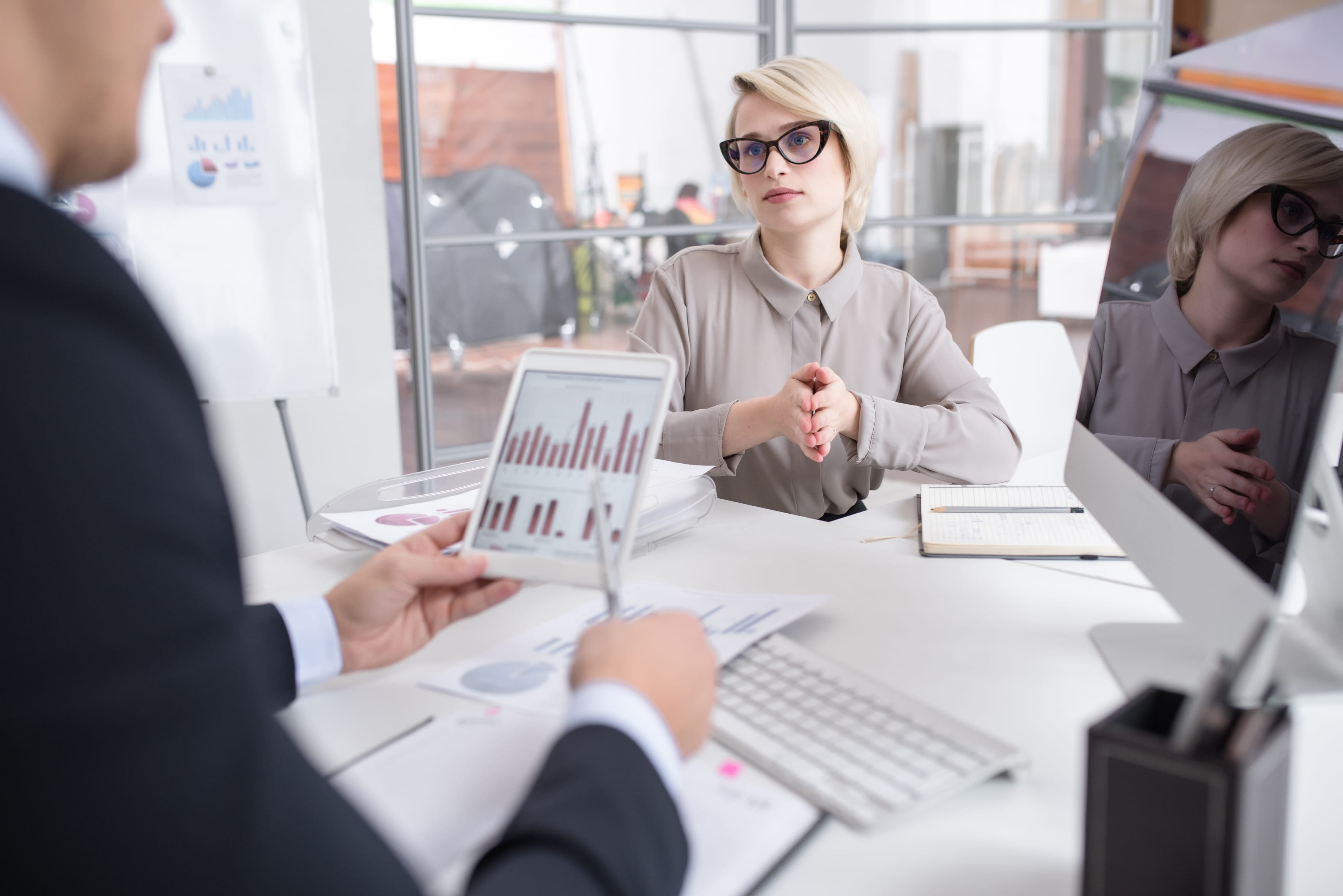 business people meeting around table with charts